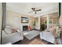 Inviting living room with a fireplace, neutral paint, and hardwood floors at 3834 Sipes Ln, Charlotte, NC 28269