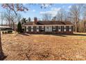 Brick ranch house with green shutters, front steps, and a spacious lawn at 44339 Us 52 N Hwy, Richfield, NC 28137