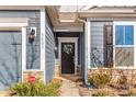 Inviting front door entrance with wreath and landscaping at 5007 Grand Champion Ct, Iron Station, NC 28080
