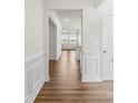 Bright hallway with wood flooring and access to living areas at 5007 Grand Champion Ct, Iron Station, NC 28080