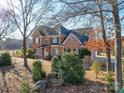 Brick house with large yard and trees in the background at 6922 Concord Hwy, Monroe, NC 28110