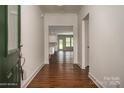 Bright entry hall with hardwood floors leading to the living area at 804 Pierce Ave, Mount Holly, NC 28120