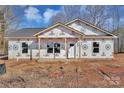 Newly constructed home exterior with gray siding and a white door at 816 Ryan St, Salisbury, NC 28144