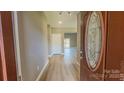Light hardwood floors and open view to living room at 1033 12Th Avenue Nw Dr, Hickory, NC 28601