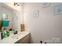 Clean bathroom with vanity, mirror, and neutral color scheme at 11315 Savannah Creek Dr, Charlotte, NC 28273