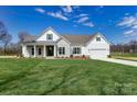 Beautiful single-Gathering home with white siding, stone accents, green shutters, and a well-maintained front lawn at 3432 Greene Rd, Monroe, NC 28110