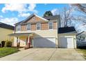 Two-story house with a two-car garage and a landscaped front yard at 4005 Linville Falls Ln, Monroe, NC 28110