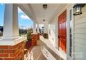 Brick walkway leading to a charming red front door at 4005 Linville Falls Ln, Monroe, NC 28110