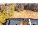 Aerial view showing house and lot, surrounded by trees at 4109 Pebblebrook Sw Cir, Concord, NC 28027