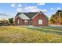 Brick ranch house with a spacious lawn at 5517 Cyrus Lee Ln, Monroe, NC 28110