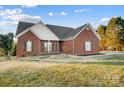 Brick ranch home with a large front yard at 5517 Cyrus Lee Ln, Monroe, NC 28110