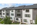 Row of townhouses, gray and white exterior, and individual entrances at 8723 Nolley Ct, Charlotte, NC 28270