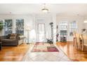 Bright and spacious entryway with hardwood floors and coat rack at 8814 Beaver Creek Dr, Charlotte, NC 28269