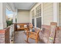 Inviting front porch with rocking chairs and decorative accents at 8814 Beaver Creek Dr, Charlotte, NC 28269