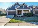 Craftsman style home with stone accents and a two car garage at 9113 Meadowmist Ln, Huntersville, NC 28078