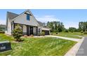 House exterior with a charming front porch and landscaping at 917 Black Beard Dr, Denver, NC 28037