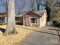 Newly renovated stone house with large windows at 1116 East Dr, Gastonia, NC 28052