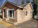 Newly renovated stone house with large windows at 1116 East Dr, Gastonia, NC 28052