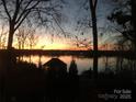 Stunning sunset over lake with house visible at 119 River Ridge Trl # E175/176, Mount Gilead, NC 27306