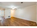 Spacious living room with hardwood floors and neutral walls at 122 Ashleigh Ct, Fort Mill, SC 29715