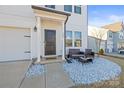 Landscaped front yard with stone and seating area at 144 Mooring Dr, Statesville, NC 28677