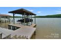 Covered boat lift and spacious dock perfect for lake access at 3255 Lake Pointe Dr, Belmont, NC 28012