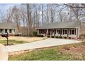 View of well-kept home with a long driveway and adjacent property at 348 Sugar Creek Xing, Fort Mill, SC 29715