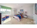 Charming bedroom with a bed, nightstand, and large window at 3680 Charles Nw St, Conover, NC 28613