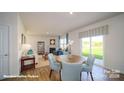 Open concept dining area with a round table and access to backyard at 3680 Charles Nw St, Conover, NC 28613