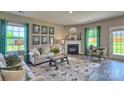 Cozy living room featuring a fireplace and green accent curtains at 3686 Charles Nw St, Conover, NC 28613