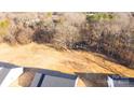 Aerial view of a lot with trees and houses at 4115 Pebblebrook Sw Cir, Concord, NC 28027
