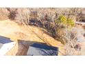 Aerial view showing homes and surrounding land at 4119 Pebblebrook Sw Cir, Concord, NC 28027