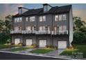 Three-story townhomes with gray exterior, balconies, and attached garages at 5636 Kingspan Dr, Charlotte, NC 28217