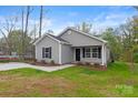 Newly built gray house with black shutters, and a small front yard at 939 Stonewall S Ave, Rock Hill, SC 29730