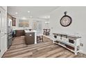 Modern kitchen featuring an island, stainless steel appliances, and hardwood floors at 1014 Beatty Woods Dr, Belmont, NC 28012