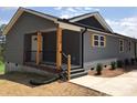 Gray house with wooden posts and a covered porch at 110 Gilliatt St, Shelby, NC 28150