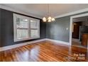 Spacious dining room with hardwood floors and dark walls at 1135 12Th Ne St, Hickory, NC 28601