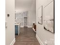 Bright hallway with kitchen and living room views at 12469 Copper Mountain Blvd, Charlotte, NC 28277