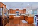 Modern kitchen with granite countertops and stainless steel appliances at 14015 Helen Benson Blvd, Davidson, NC 28036