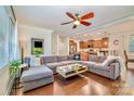Open living space with L-shaped sectional sofa and view into kitchen at 14015 Helen Benson Blvd, Davidson, NC 28036