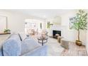 Bright living room featuring a fireplace and comfortable seating at 711 Concord Rd, Davidson, NC 28036