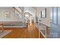 Bright and spacious entryway with hardwood floors and views to the living room at 10102 Grimsby Ct, Huntersville, NC 28078