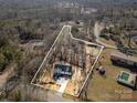 A nice aerial view of a newly constructed home with a large lot that is partially wooded at 108 Robinson Dr, Cherryville, NC 28021