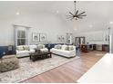 Open concept living room with vaulted ceilings and hardwood floors at 108 Robinson Dr, Cherryville, NC 28021