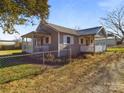 Gray siding ranch home with white picket fence at 117 Mardon Ln, Statesville, NC 28677