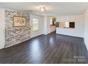 Living room with fireplace and dark laminate floors at 117 Mardon Ln, Statesville, NC 28677