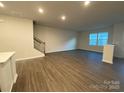 Spacious living room with hardwood floors and plenty of natural light at 12841 Canton Side Ave, Charlotte, NC 28273