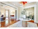 Elegant foyer with hardwood floors, marble table, and seamless flow into living spaces at 1333 Carlton Ave, Charlotte, NC 28203