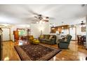 Cozy living room featuring hardwood floors, comfortable seating, and an open floor plan at 16415 Capps Rd, Charlotte, NC 28278