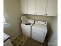 Bright laundry room with washer and dryer at 194 W Waterlynn Rd, Mooresville, NC 28117